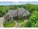 Charming aerial view of stately home highlighting manicured lawn, fountain and circular drive at 20170 Starlight Ct, Noblesville, IN 46062