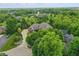 Aerial view of an elegant estate showcasing lush landscaping and mature trees at 20170 Starlight Ct, Noblesville, IN 46062