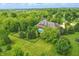 Stunning aerial view of a luxury home with an in-ground pool and meticulously landscaped garden at 20170 Starlight Ct, Noblesville, IN 46062