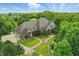 Beautiful aerial view of custom home with manicured lawn, fountain and circular drive at 20170 Starlight Ct, Noblesville, IN 46062