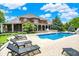Expansive backyard featuring a pool, lounge chairs, and lush landscaping, perfect for outdoor living at 20170 Starlight Ct, Noblesville, IN 46062