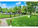 Spacious backyard with artificial turf, dog agility equipment, and secure fencing for Gathering enjoyment at 20170 Starlight Ct, Noblesville, IN 46062