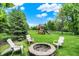 Large backyard with a stone fire pit and playground for endless outdoor enjoyment at 20170 Starlight Ct, Noblesville, IN 46062