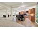 Finished basement with bar, custom tile flooring, granite counters, stainless appliances, and ample seating at 20170 Starlight Ct, Noblesville, IN 46062