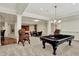 Finished basement rec room with a pool table, games table, bar, and other great entertaining features at 20170 Starlight Ct, Noblesville, IN 46062