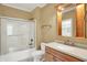 Well-lit bathroom with a shower-tub combo, vanity with sink, and neutral finishes at 20170 Starlight Ct, Noblesville, IN 46062