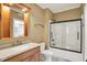 Bright bathroom features a shower-tub combo with glass doors and a charming vanity with lots of storage at 20170 Starlight Ct, Noblesville, IN 46062