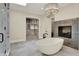 Bathroom with soaking tub, fireplace, and large shower at 20170 Starlight Ct, Noblesville, IN 46062