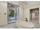 Spacious bathroom featuring a soaking tub and walk-in shower with glass enclosure at 20170 Starlight Ct, Noblesville, IN 46062