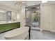 Bathroom with soaking tub, walk-in shower, and modern double vanity at 20170 Starlight Ct, Noblesville, IN 46062