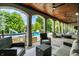 Comfortable covered patio with ceiling fans, offering views of the swimming pool and manicured backyard at 20170 Starlight Ct, Noblesville, IN 46062