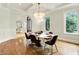 Dining area with natural light, hardwood floors, and modern furnishings at 20170 Starlight Ct, Noblesville, IN 46062
