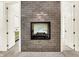 The fireplace features stone work and also serves as a wall that separates two doorways at 20170 Starlight Ct, Noblesville, IN 46062