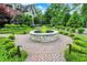 Paver walkway to front fountain with manicured garden in front of the house at 20170 Starlight Ct, Noblesville, IN 46062