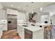 Bright eat-in kitchen featuring stainless steel appliances, an island, and sleek, white cabinetry at 20170 Starlight Ct, Noblesville, IN 46062