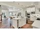 Open concept kitchen with large island and bar seating, stainless steel appliances and tile flooring at 20170 Starlight Ct, Noblesville, IN 46062