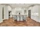 Bright kitchen with large island and seating, stainless steel appliances, and pendant lighting at 20170 Starlight Ct, Noblesville, IN 46062