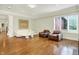 Bright living room with a white sofa, two chairs, hardwood floors, and a modern design at 20170 Starlight Ct, Noblesville, IN 46062