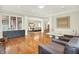 Bright living room with hardwood floors, modern furniture, and large windows offering natural light at 20170 Starlight Ct, Noblesville, IN 46062
