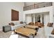 Spacious living room with a two story ceiling, two sofas, two sitting chairs, and wooden coffee tables at 20170 Starlight Ct, Noblesville, IN 46062
