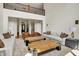 Spacious living room with a two story ceiling, two sofas, two sitting chairs, and wooden coffee tables at 20170 Starlight Ct, Noblesville, IN 46062