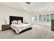 Main bedroom suite with large bed, side tables, sitting area, and natural light at 20170 Starlight Ct, Noblesville, IN 46062