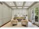 Well-lit office with coffered ceilings, built in shelving, french doors and two chairs at 20170 Starlight Ct, Noblesville, IN 46062