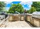 Spacious outdoor kitchen with stone surround and stainless steel appliances for outdoor entertainment at 20170 Starlight Ct, Noblesville, IN 46062