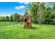 Playground with swings, slide, and elevated playhouse, perfect for children at 20170 Starlight Ct, Noblesville, IN 46062