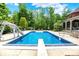 Beautiful in-ground pool with slide, diving board, and spacious patio area for entertaining guests at 20170 Starlight Ct, Noblesville, IN 46062