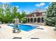 Beautiful in-ground pool with slide and automatic cover, complemented by the backyard and home at 20170 Starlight Ct, Noblesville, IN 46062