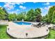 Beautiful in-ground pool with stone surround and ample lounging space for relaxation and entertainment at 20170 Starlight Ct, Noblesville, IN 46062