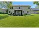 The rear of the house shows the backyard with a gazebo that enhances outdoor living and entertaining possibilities at 24 Cinnamon Ct, Brownsburg, IN 46112