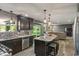 Open-concept kitchen with a view into the Gathering room and sliding glass doors to the patio at 24 Cinnamon Ct, Brownsburg, IN 46112