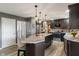 Modern kitchen with stainless steel appliances, granite countertops, and a breakfast bar at 24 Cinnamon Ct, Brownsburg, IN 46112