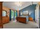 Comfortable main bedroom with a large window, a queen bed, and ample natural light at 24 Cinnamon Ct, Brownsburg, IN 46112