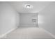 Empty bedroom with carpeted floor, a single window, and neutral paint at 2448 Broadway St, Indianapolis, IN 46205