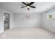 Large bedroom with carpet, natural light, and an open doorway with a bathroom visible in the background at 2448 Broadway St, Indianapolis, IN 46205