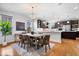 Cozy dining area with natural light, table, and rug adjacent to a modern kitchen at 2448 Broadway St, Indianapolis, IN 46205