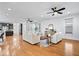 Spacious open-concept layout featuring hardwood floors and seamless transitions to kitchen at 2448 Broadway St, Indianapolis, IN 46205