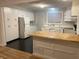 Bright kitchen with white cabinets, a butcher block island, and dark wood-look flooring at 249 Spring St, Plainfield, IN 46168