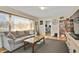 Inviting living room with a comfortable sofa, large windows, and stylish decor at 249 Spring St, Plainfield, IN 46168