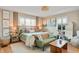 Serene primary bedroom with light wood floors, neutral walls, and a large window at 249 Spring St, Plainfield, IN 46168