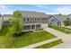 This aerial view showcases a well-maintained, two-story home with a two car garage and lush front lawn at 2626 Solidago Dr, Plainfield, IN 46168