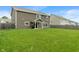 View of the expansive backyard showing lawn, patio and the exterior of the house at 2626 Solidago Dr, Plainfield, IN 46168