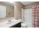 Neutral bathroom with modern vanity, framed mirror and tub-shower combination with curtain at 2626 Solidago Dr, Plainfield, IN 46168