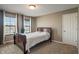 Bedroom with neutral walls, carpet, and windows with privacy blinds and curtains at 2626 Solidago Dr, Plainfield, IN 46168