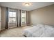 Well-lit bedroom with carpet, neutral paint, blinds and curtains on the windows at 2626 Solidago Dr, Plainfield, IN 46168