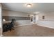 Spacious bonus room features neutral carpet, fresh paint, and multiple entryways at 2626 Solidago Dr, Plainfield, IN 46168