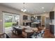 Eat-in kitchen and dining area with natural light coming from the sliding glass doors that lead to the yard at 2626 Solidago Dr, Plainfield, IN 46168
